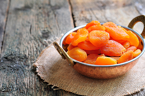 Dried apricot in a copper bowl
