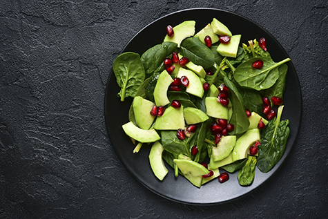 Avocado salad with baby spinach and pomegranate