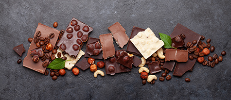Various chocolate pieces, coffee beans and nuts