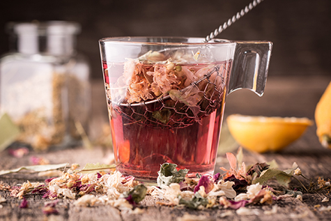 Mix of healthy herbal tea on vintage wooden background
