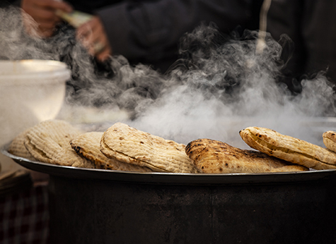 Pita, Bazlama, Somun bread. The process of making fresh pita bread. Street food. Food festival.