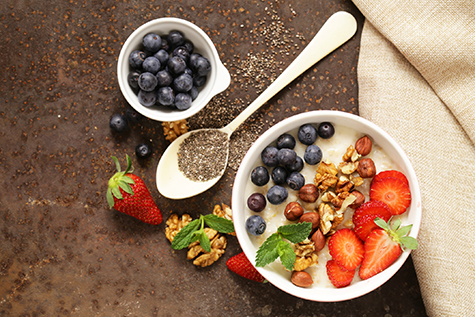 Oatmeal porridge with nuts and berries for a healthy breakfast