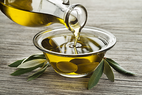 Bottle of Olive oil pouring