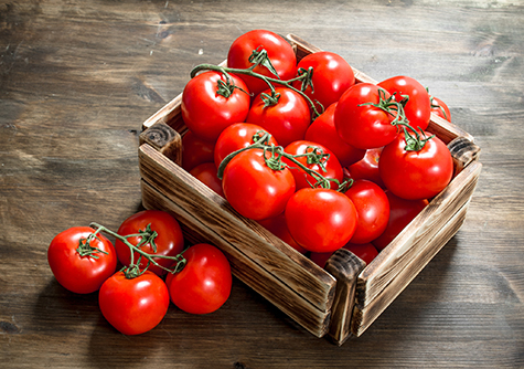 Fresh tomatoes in a box.