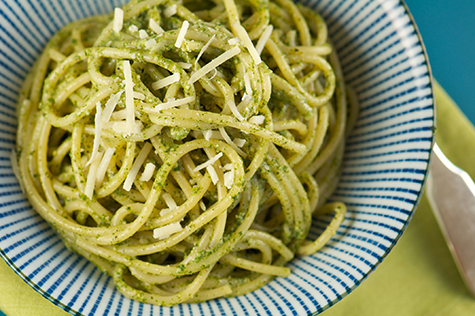 Bowl of Pasta with Pesto Sauce and Grated Cheese
