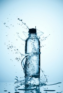 plastic bottle of water and splash around it