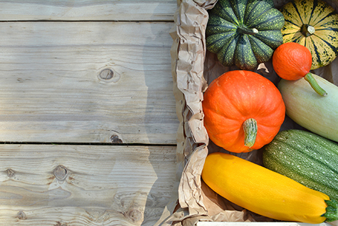 Pumpkins and squashes on wood