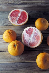 Fruit Grapefruit and tangerines on wooden background