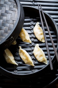 Tasty and hot chinese dumplings in wooden steamer
