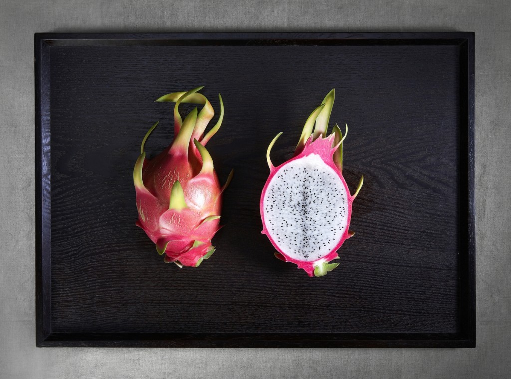 Cross section of exotic fruit on tray
