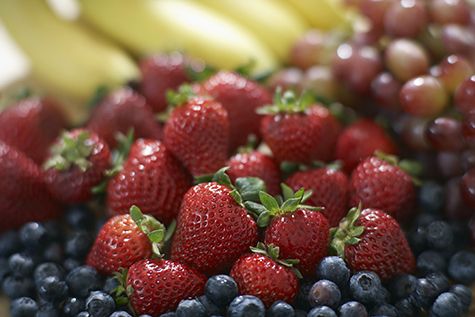 Blackberries, strawberries, grapes and bananas, close-up, selective focus