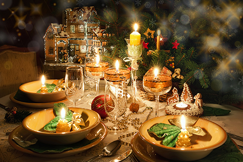 Christmas dinner table with candles with christmas atmosphere