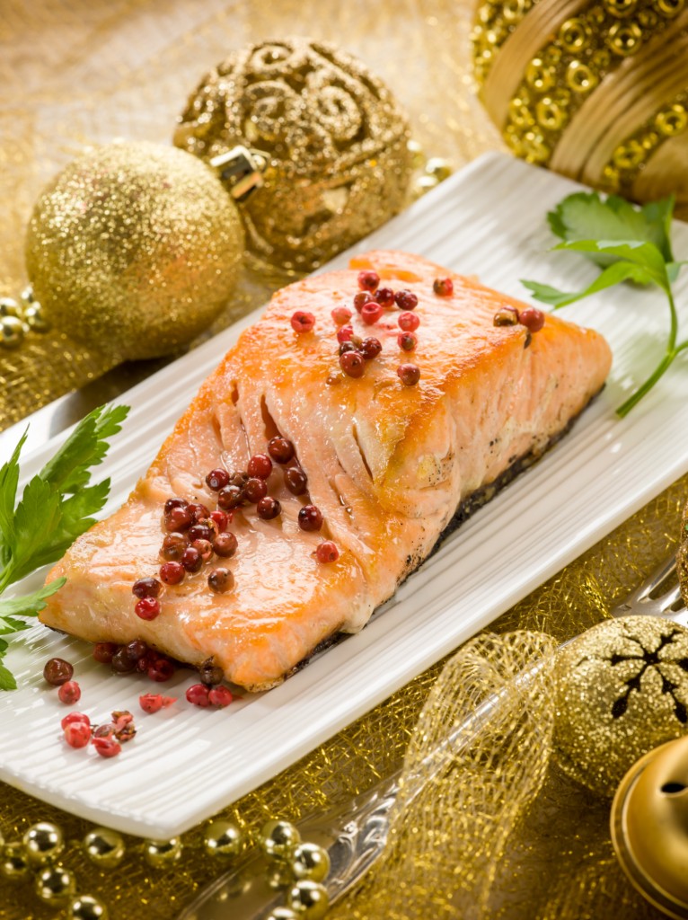 grilled salmon with pink pepper on christmas table