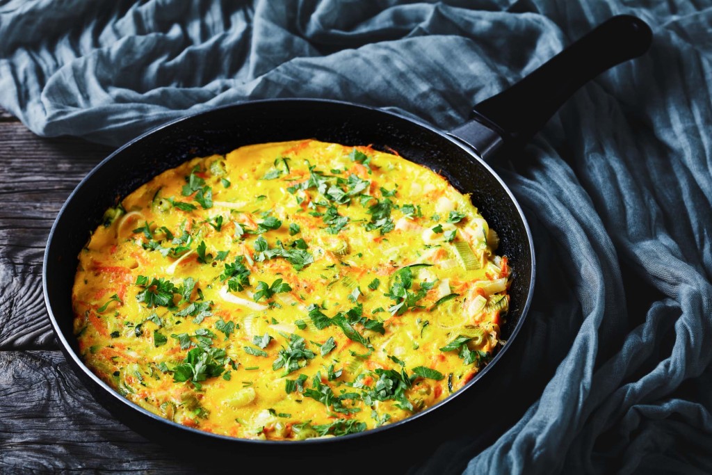 Healthy breakfast: vegetable and chicken eggs frittata of shredded zucchini and carrot