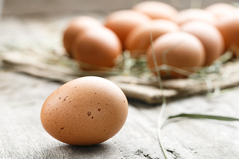 fresh organic farm eggs lie on burlap